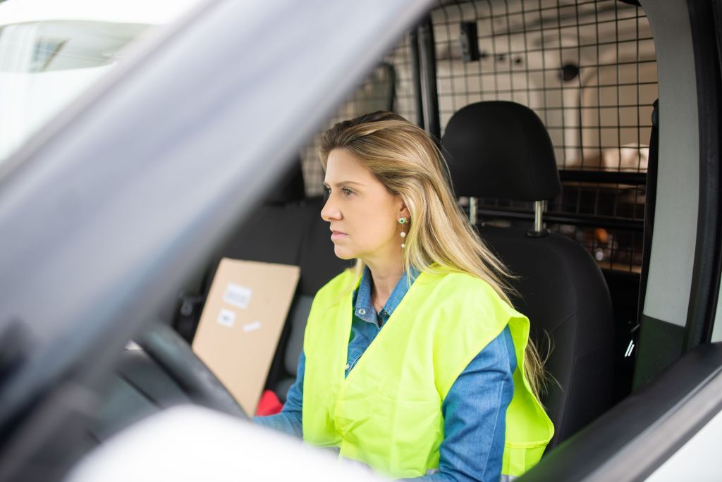 a woman driving a van